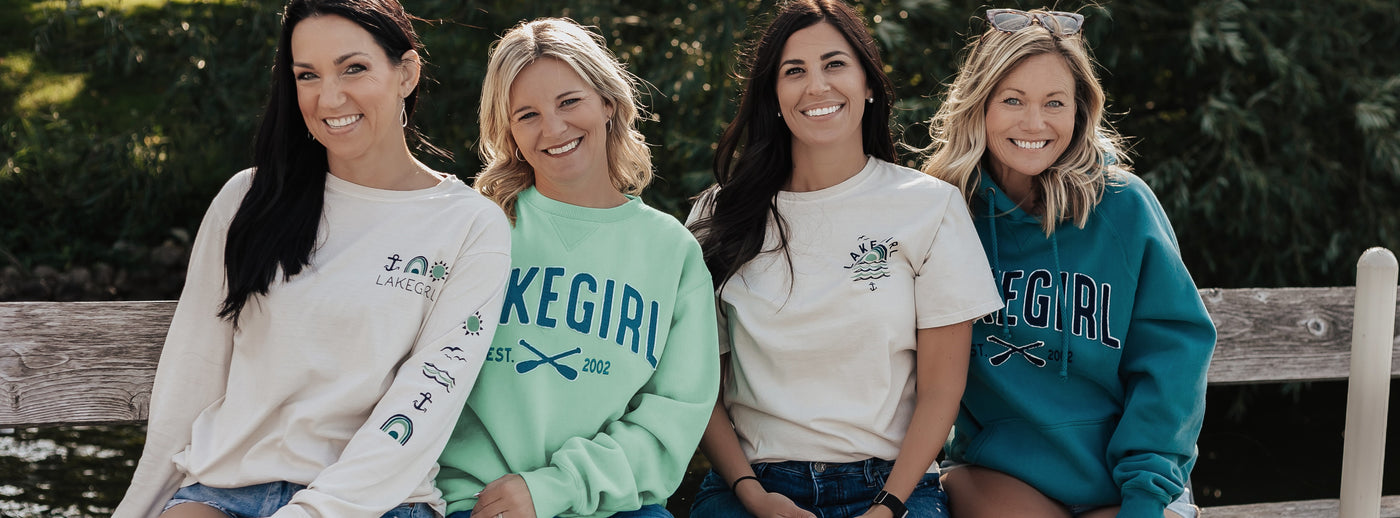 four models wearing lakegirl sweatshirts and tees