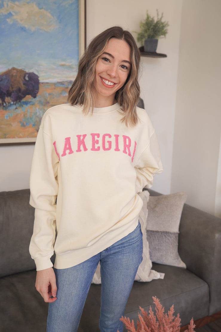 Model wearing a white crew neck with lakegirl design