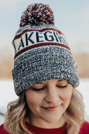 Person wearing a beanie with 'LAKEGIRL' text 